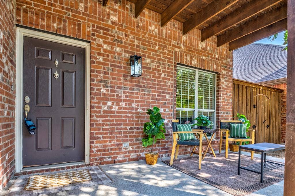 10138 Planters Row Drive, Frisco, TX 75033 Covered front porch with room for seating and a front-row view of evening sunsets.