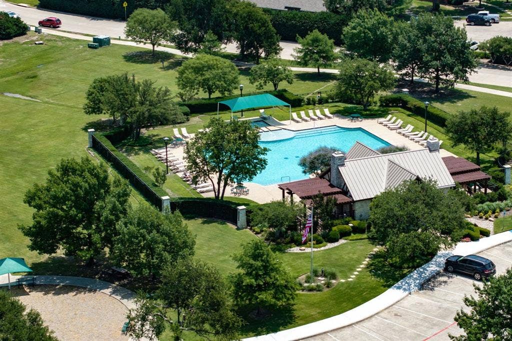 10138 Planters Row Drive, Frisco, TX 75033 One of two community pools included with the HOA, surrounded by green space for easy summer afternoons.
