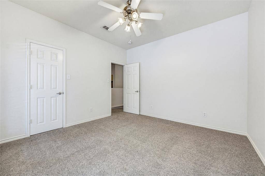 10138 Planters Row Drive, Frisco, TX 75033 Upstairs bedroom with ceiling fan, and neutral finishes ready for any style.
