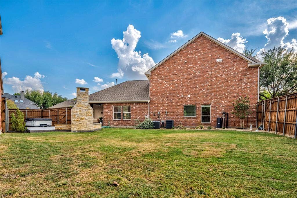 10138 Planters Row Drive, Frisco, TX 75033 A private, oversized lot with a wide grassy yard and mature trees, offering room to run, toss the ball, and gather all season long.