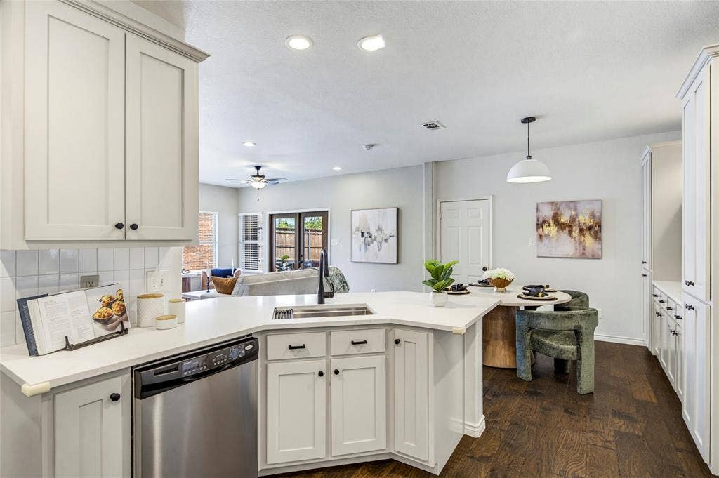 10138 Planters Row Drive, Frisco, TX 75033 The open layout connects the kitchen to the breakfast area and living room, so hosting feels effortless from prep to plate.