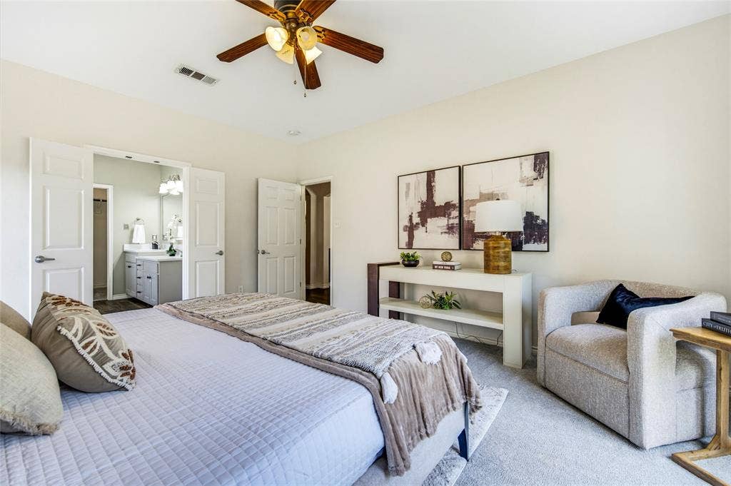 10138 Planters Row Drive, Frisco, TX 75033 Room for a king bed plus a sitting area, with the primary retreat set apart from the upstairs bedrooms for true separation.