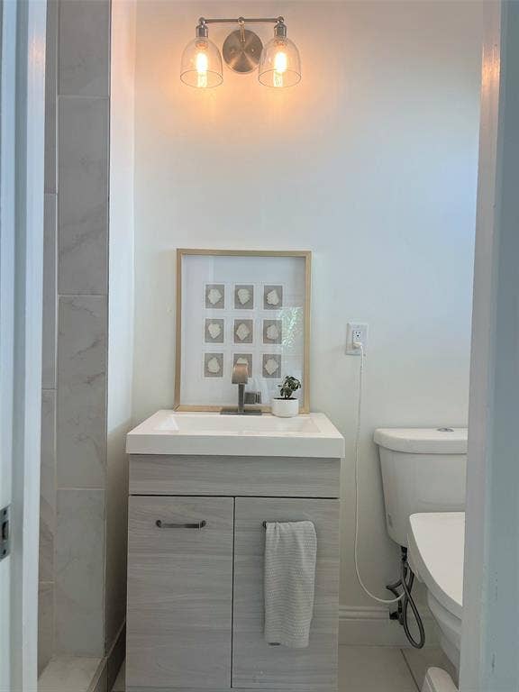 1200 Daisy Lane, Irving, TX 75061 Vanity with integrated sink, wood-style cabinetry, and a single-handle faucet