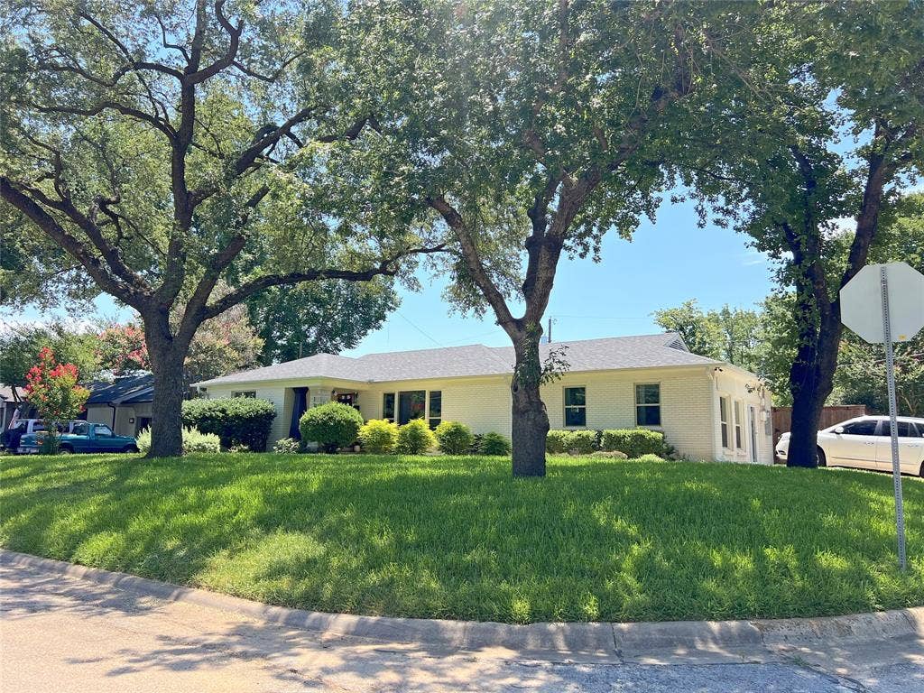 1200 Daisy Lane, Irving, TX 75061 1200 Daisy, a white brick ranch home on a ~.22 acre lot with a ~5 year old roof and lush greenery