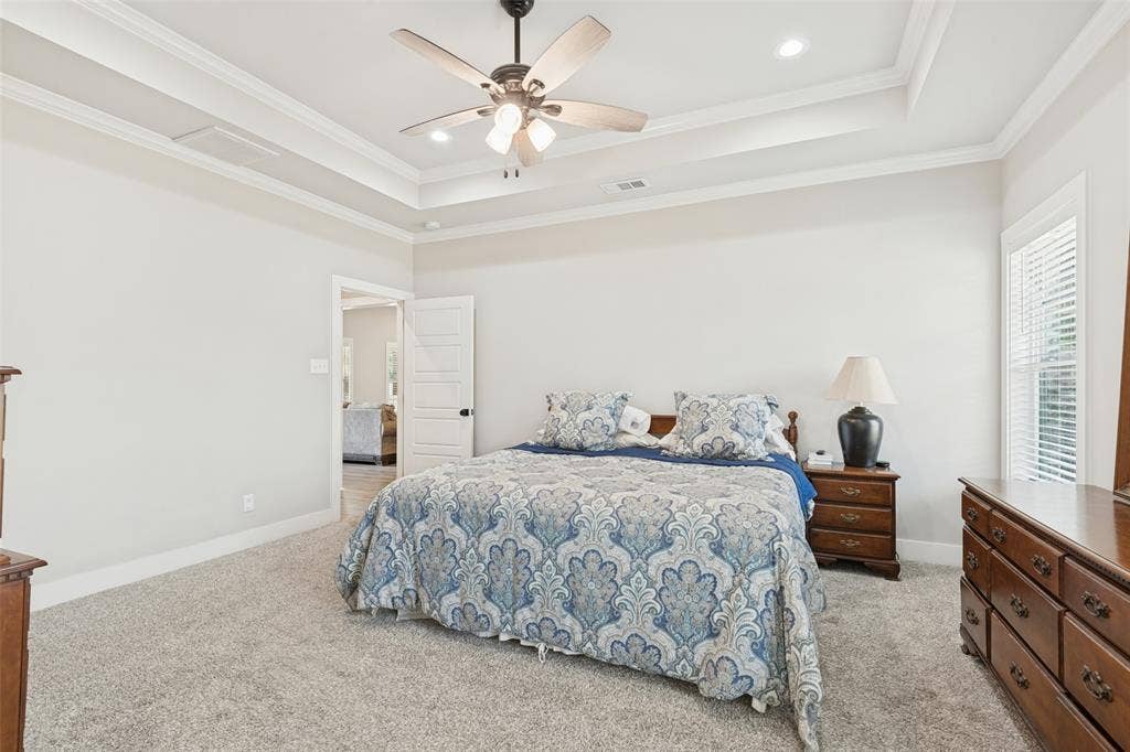 108 Rye Place, Gun Barrel City, TX 75156 Recessed lighting, ceiling fan with light fixture, tray ceiling, carpet flooring, and white window blinds
