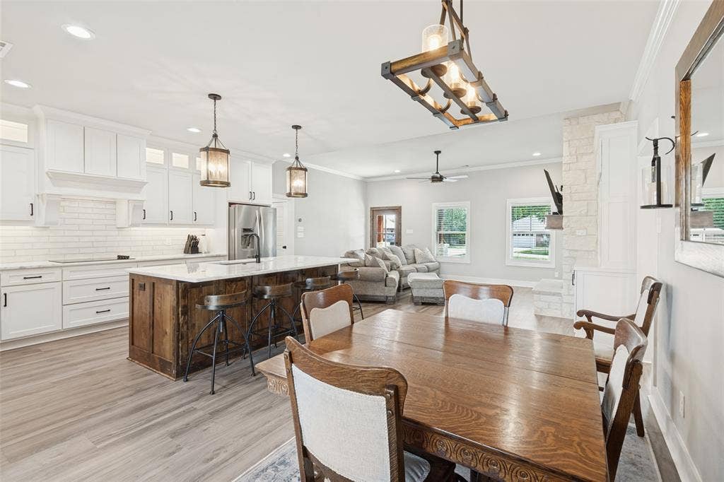108 Rye Place, Gun Barrel City, TX 75156 Kitchen featuring white cabinetry, subway tile backsplash, and a wood-finish island