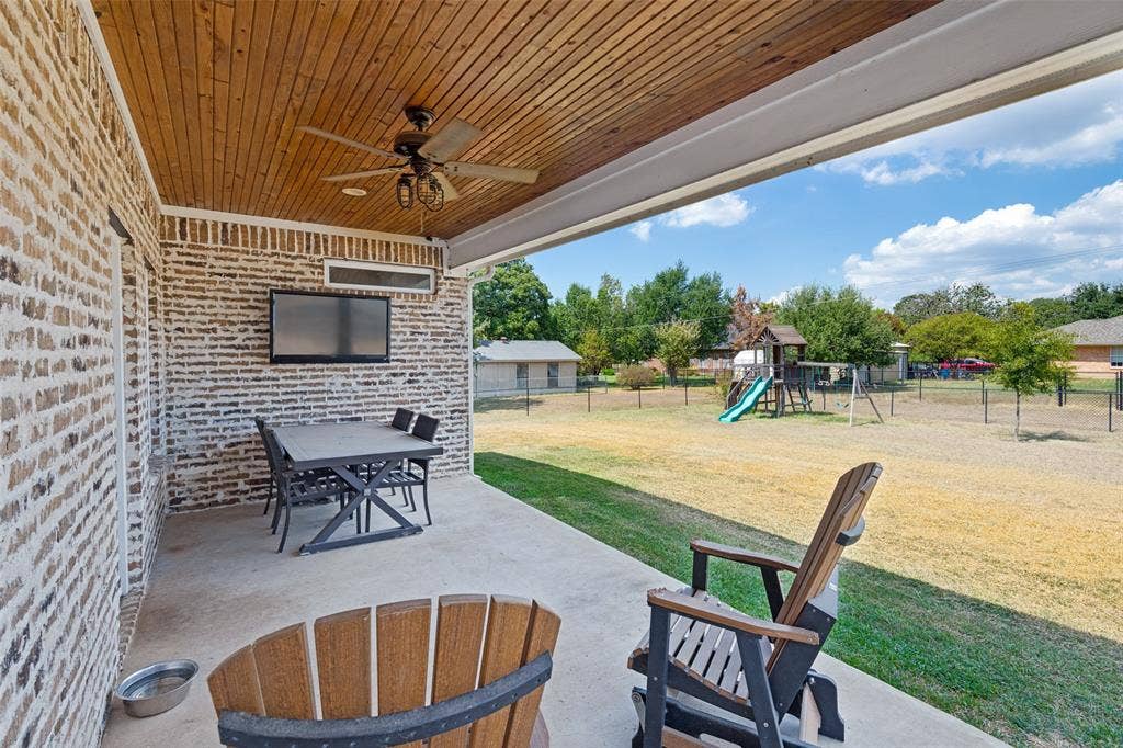 108 Rye Place, Gun Barrel City, TX 75156 Covered patio with a wood-finish plank ceiling and a ceiling fan
