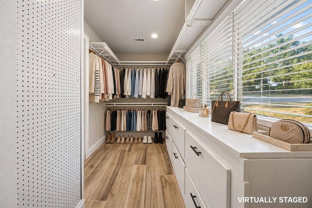Huge walk in primary closet.