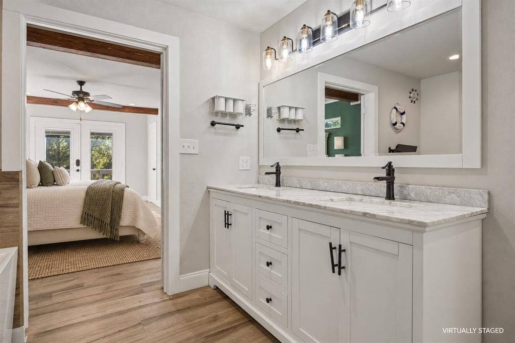 Dual sinks, soaking tub for two with a TV, separate shower and water closet.
