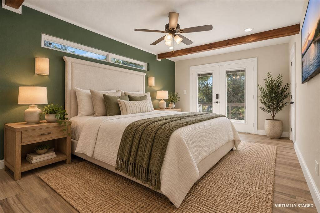 With its own entrance onto the spacious back patio, this primary suite is a true relaxing retreat.