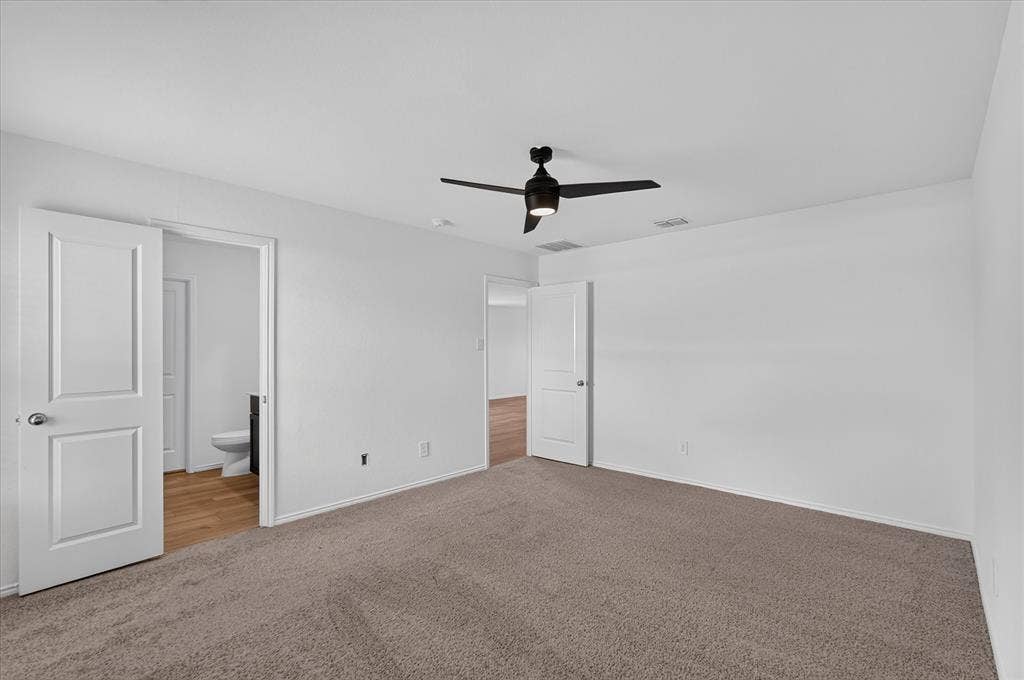 Recessed lighting, ceiling fan, white paneled doors, light brown carpet flooring, wood-finish flooring