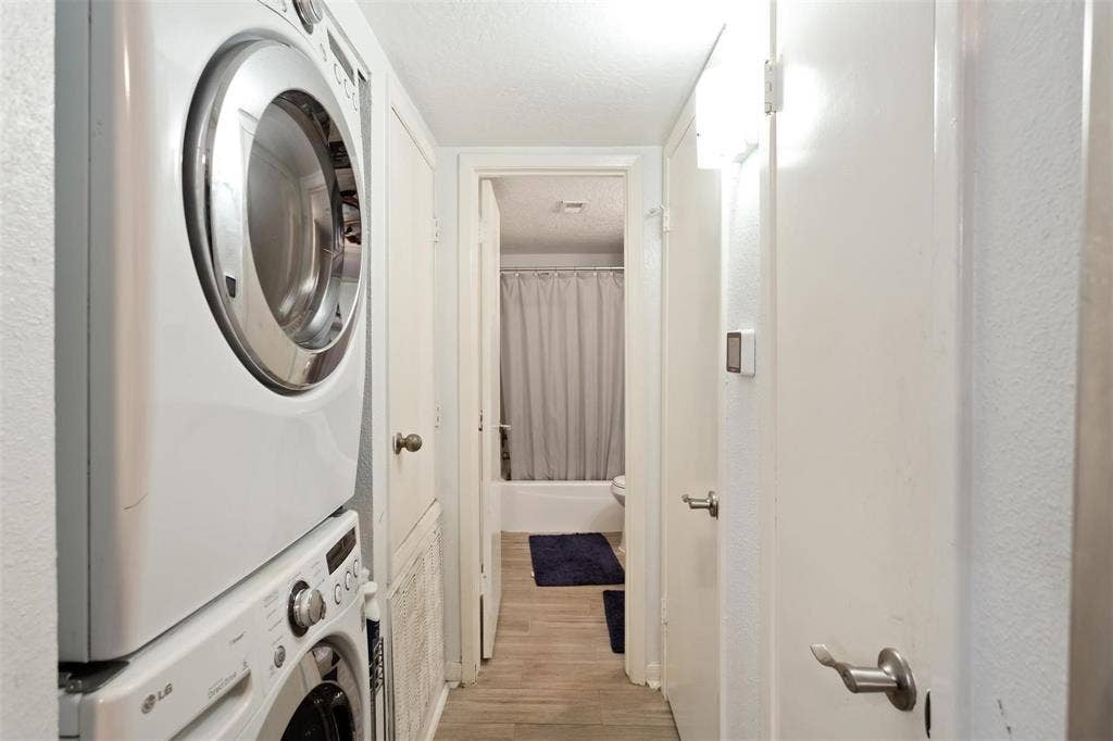 13026 Leader Street, #951, Houston, TX 77072 Bathroom 2 - Stackable white laundry appliances