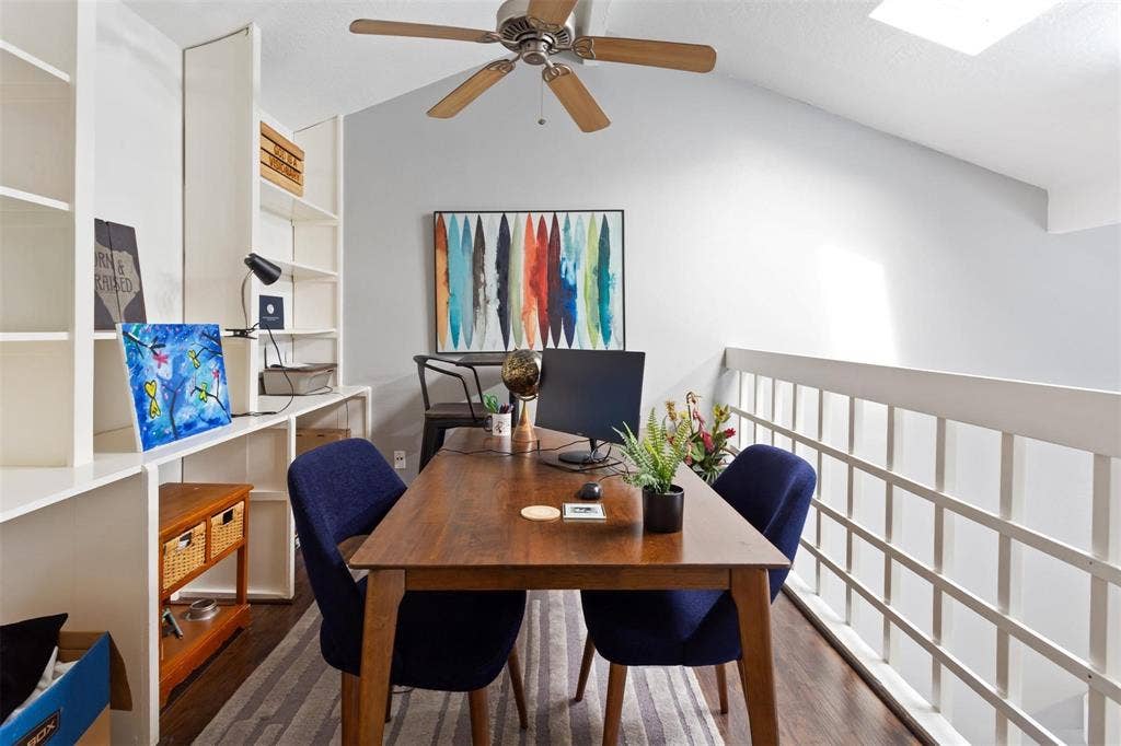 13026 Leader Street, #951, Houston, TX 77072 Vaulted ceiling with skylight, wood-finish flooring, built-in shelving, ceiling fan, and white railing
