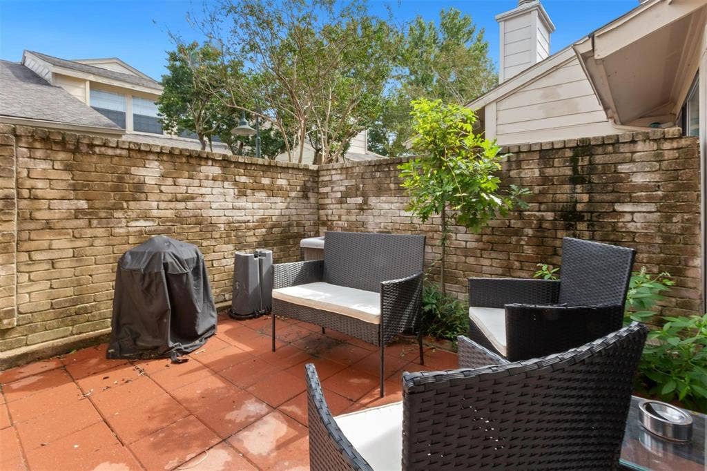 13026 Leader Street, #951, Houston, TX 77072 Private patio area featuring brick walls and red tile flooring