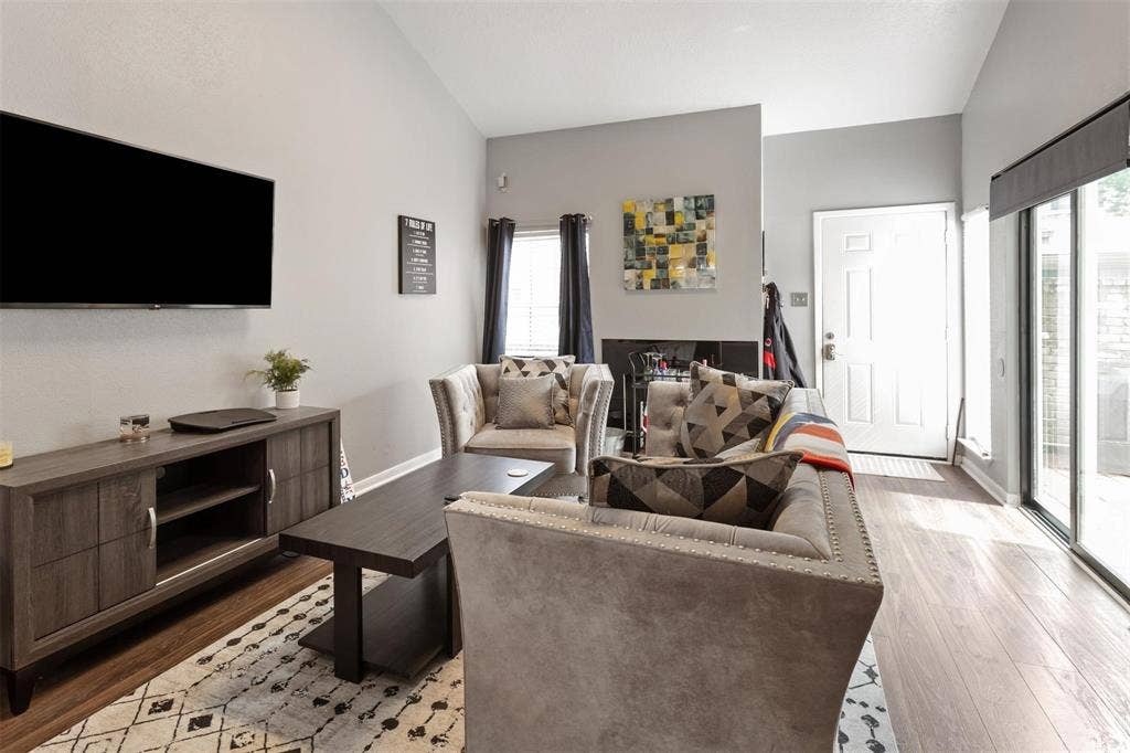 13026 Leader Street, #951, Houston, TX 77072 Vaulted ceiling, wood-finish flooring, sliding glass door, white paneled entry door, built-in shelving