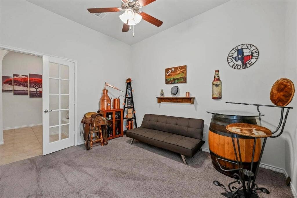 602 Brock Drive, Anna, TX 75409 Carpeted room with high ceilings, a ceiling fan, and French doors