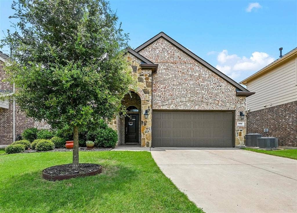602 Brock Drive, Anna, TX 75409 Brick and stone exterior with an arched entry