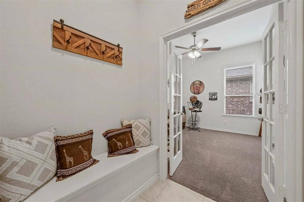 602 Brock Drive, Anna, TX 75409 Built-in entryway bench with a wood-finish coat rack