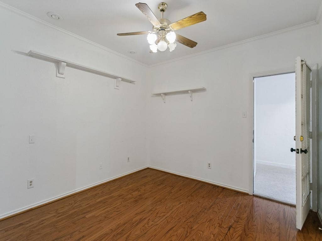 3309 Wolfe Court, Plano, TX 75025 Wood-finish flooring with crown molding, ceiling fan with integrated lighting, and recessed lighting