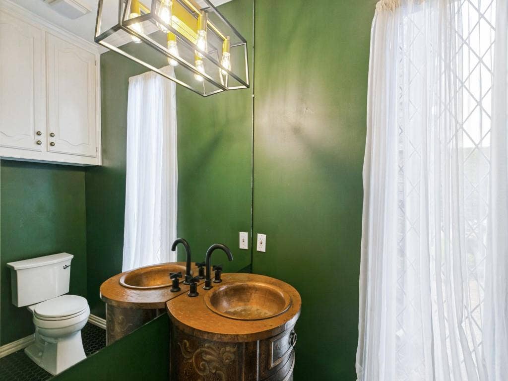 3309 Wolfe Court, Plano, TX 75025 Dual copper vessel sinks with dark bronze fixtures