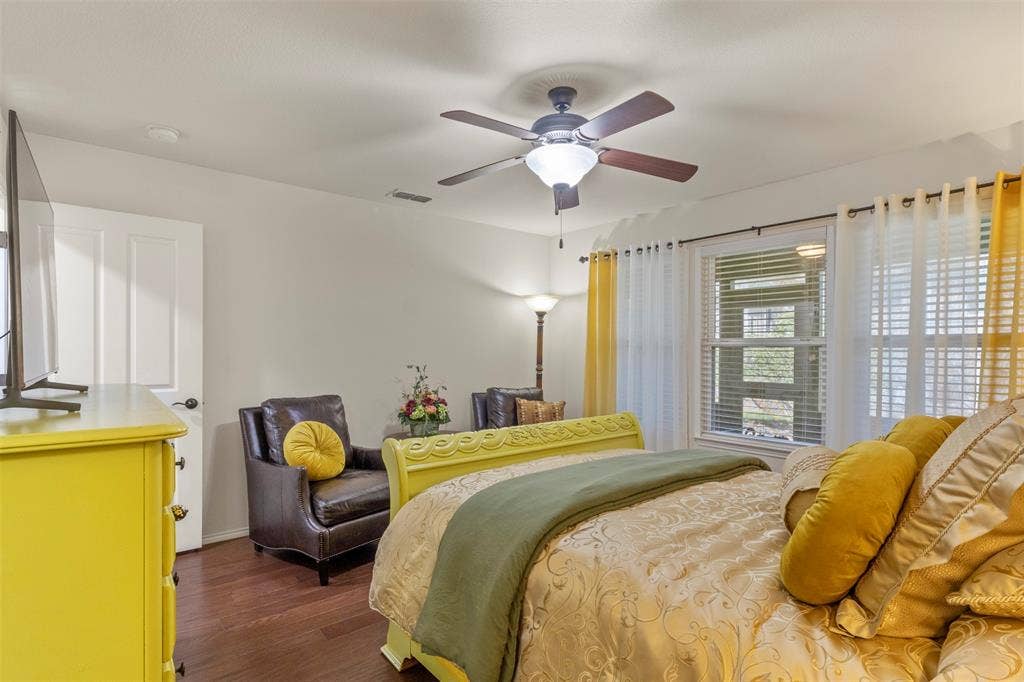 146 Montague Lane, Frisco, TX 75036 Hardwood-finish flooring, ceiling fan with integrated lighting, window with blinds, and white interior door