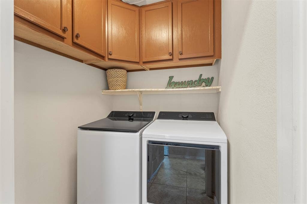 146 Montague Lane, Frisco, TX 75036 Upper cabinetry with wood-finish doors, open shelving, and tile flooring