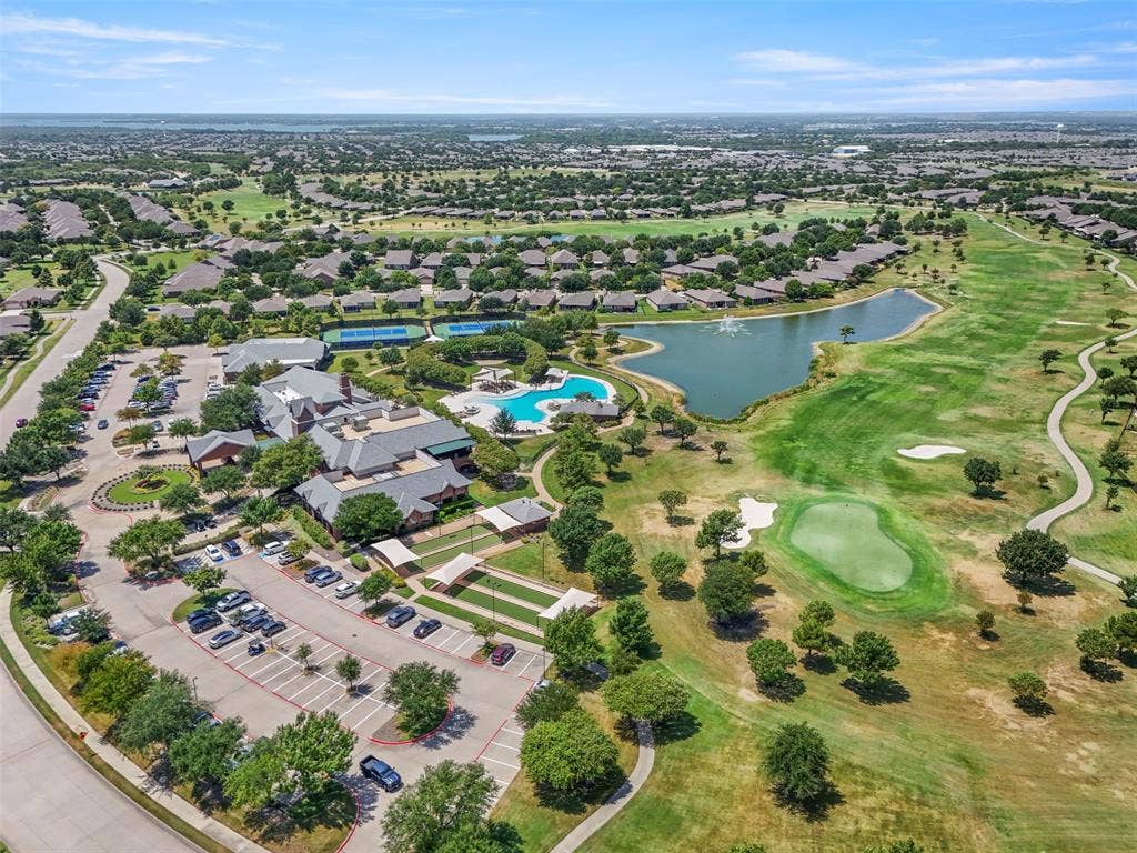 146 Montague Lane, Frisco, TX 75036 Expansive community featuring a golf course, a large clubhouse, multiple tennis courts, a resort-style swimming pool, and a community pond
