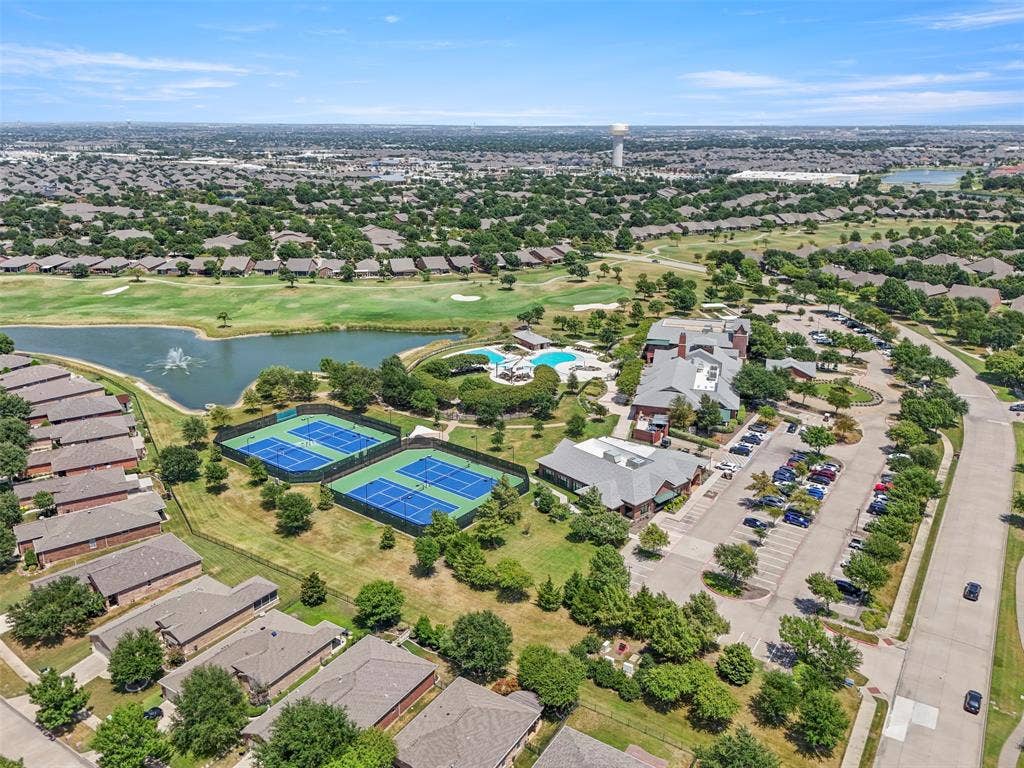 146 Montague Lane, Frisco, TX 75036 Community amenities featuring multiple tennis courts, a swimming pool with lounge areas, a golf course with a water feature, a clubhouse, and ample parking