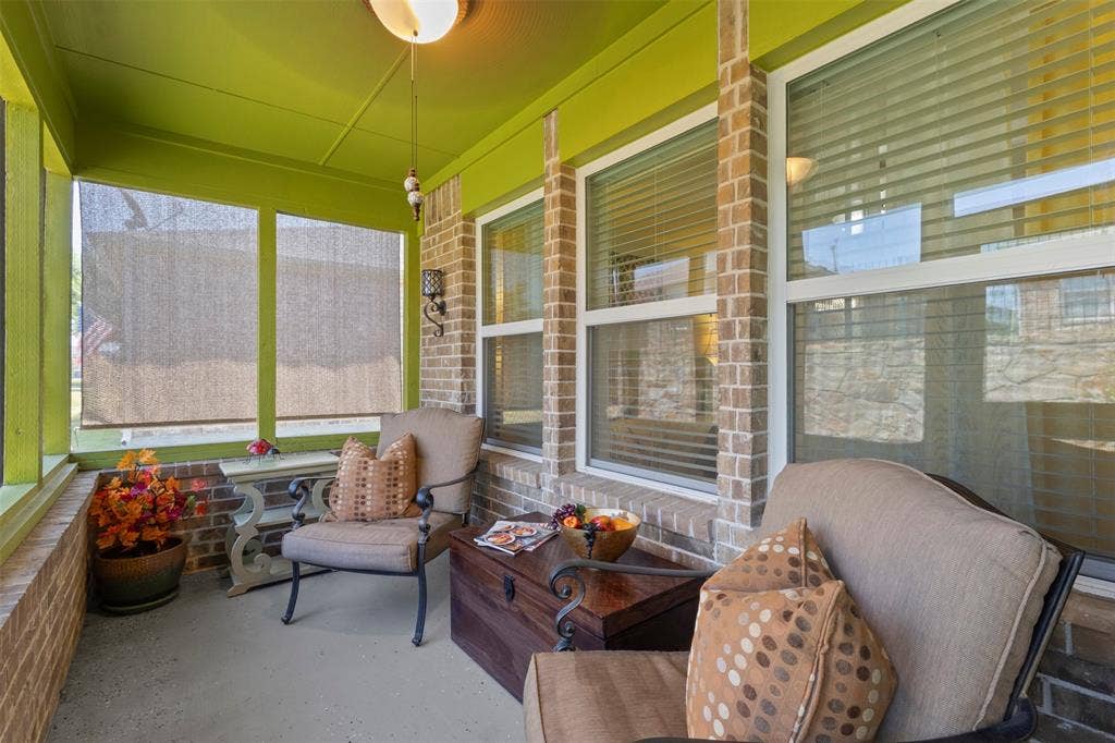 146 Montague Lane, Frisco, TX 75036 Screened porch featuring brick accents, recessed lighting, and a durable concrete floor