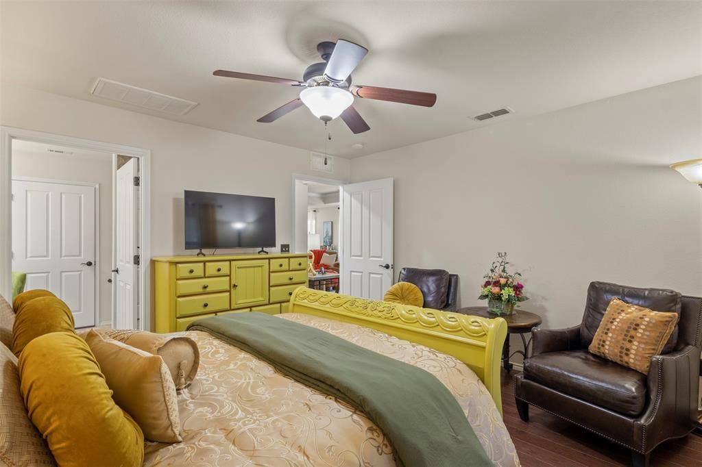 146 Montague Lane, Frisco, TX 75036 Wood-finish flooring with a ceiling fan light fixture