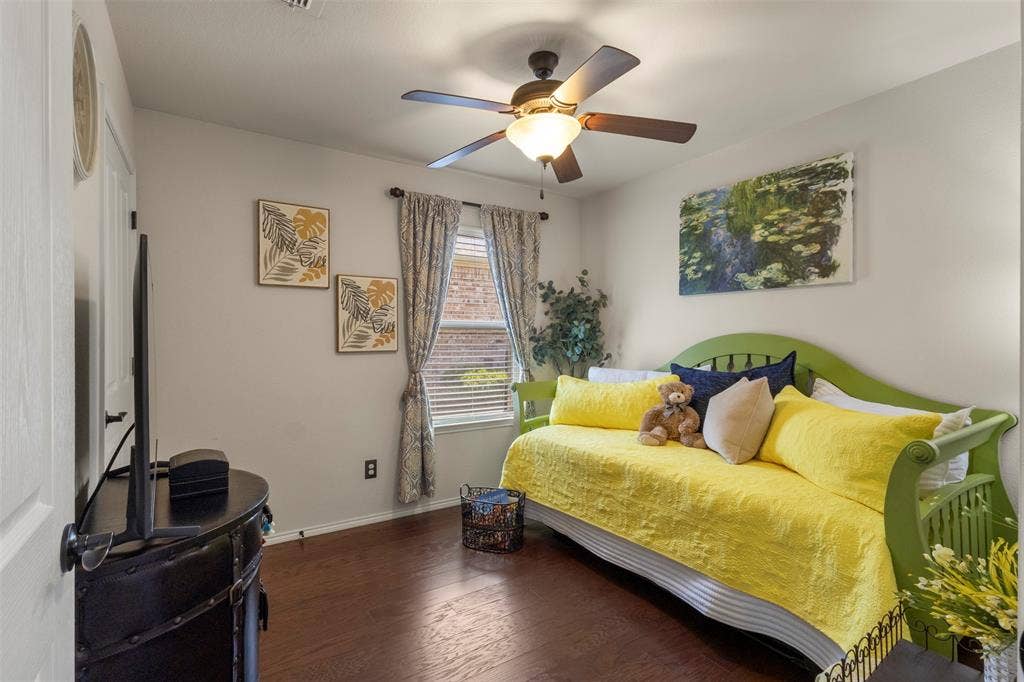 146 Montague Lane, Frisco, TX 75036 Recessed window with blinds, wood-finish flooring, ceiling fan with integrated lighting, and neutral wall tones