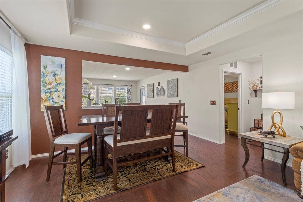 146 Montague Lane, Frisco, TX 75036 Wood-finish flooring throughout, tray ceiling with recessed lighting, and a wide cased opening