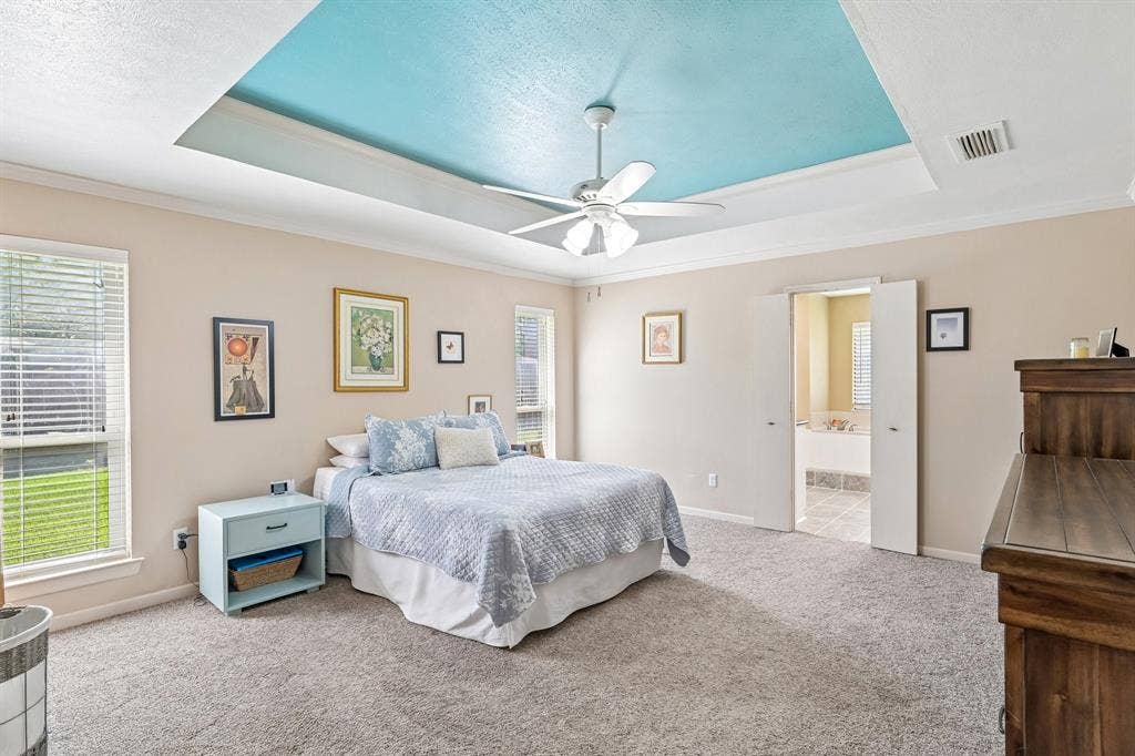 3441 Sheffield Circle, Plano, TX 75075 Tray ceiling with a textured finish, ceiling fan, and carpeted flooring