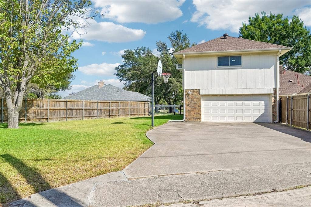 3441 Sheffield Circle, Plano, TX 75075 Two-story property featuring a white paneled exterior, brick veneer accents, and an attached two-car garage