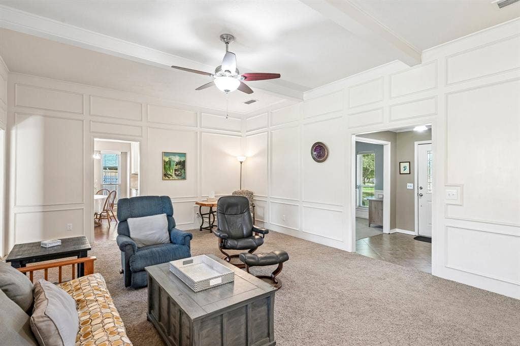 3441 Sheffield Circle, Plano, TX 75075 Coffered ceiling detail, decorative wall molding, ceiling fan, and carpet flooring