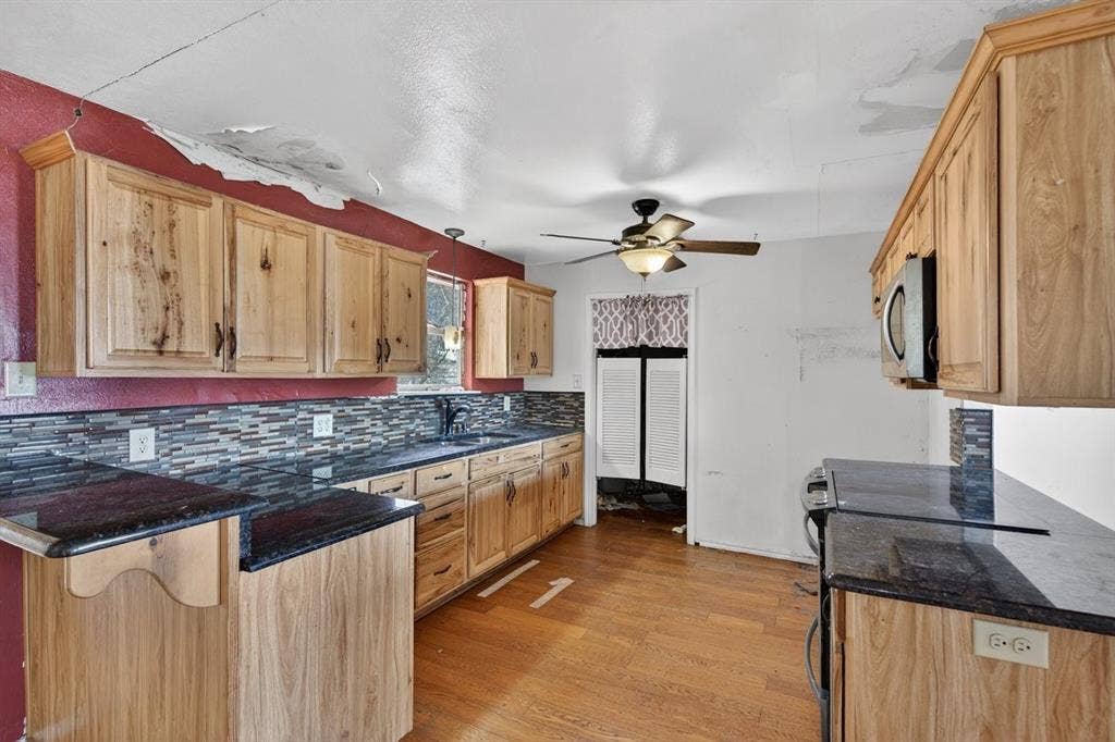 20019 Patricia Drive, Kemp, TX 75143 Kitchen has granite counter tops, updated cabinets and appliances.