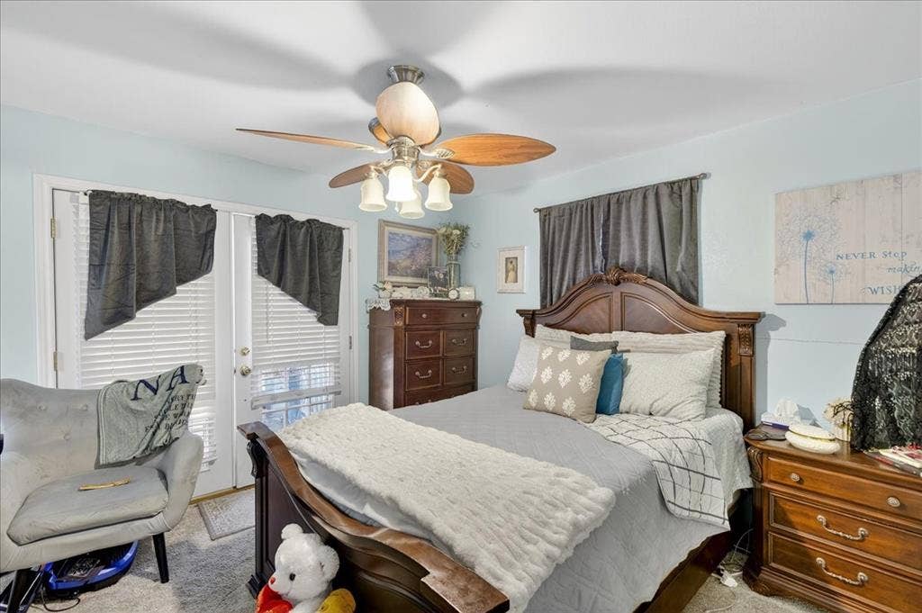 20019 Patricia Drive, Kemp, TX 75143 Primary bedroom with doors going out on to the patio and an ensuite bathroom