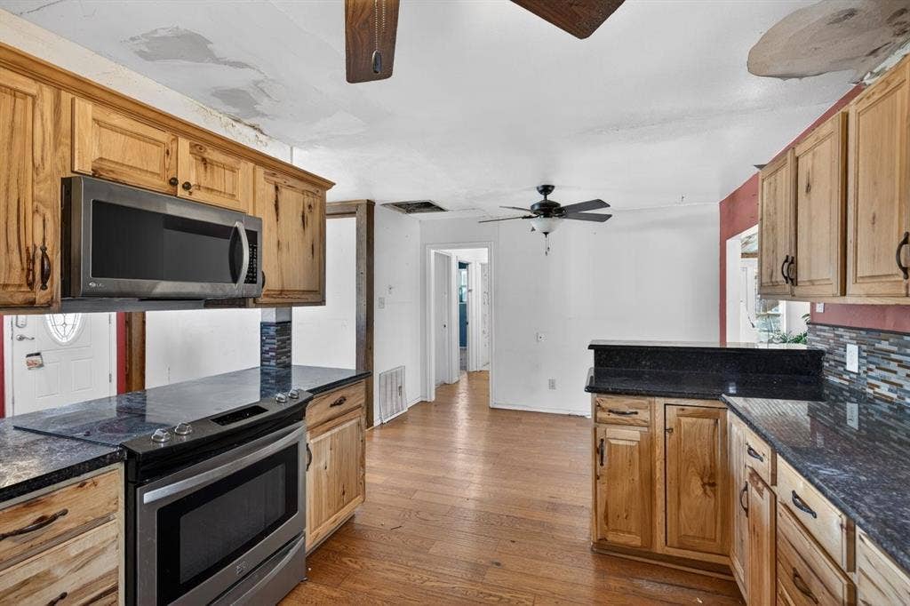 20019 Patricia Drive, Kemp, TX 75143 Kitchen has granite countertops, updated cabinets and appliances.