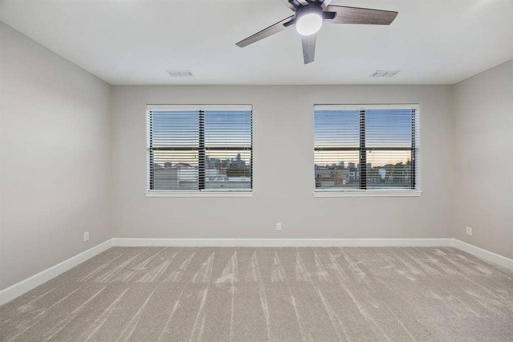 1801 Annex Avenue, #402, Dallas, TX 75204 Primary bedroom with unobstructed skyline view.