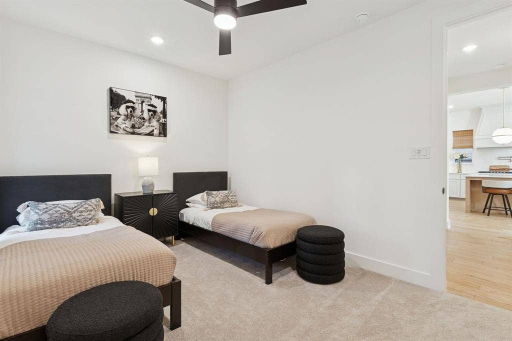 1117 Bradford Street, Celina, TX 75009 Neutral-toned carpeted room featuring a ceiling fan with integrated lighting, recessed lighting, and white baseboards