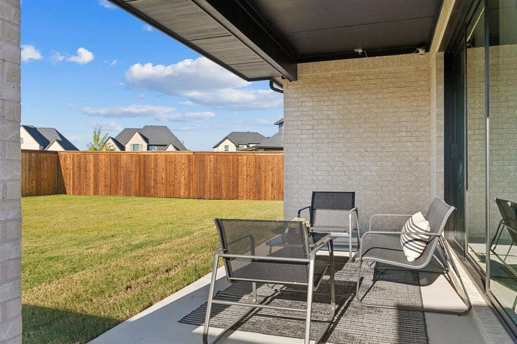 1117 Bradford Street, Celina, TX 75009 Covered patio with light-colored brick exterior
