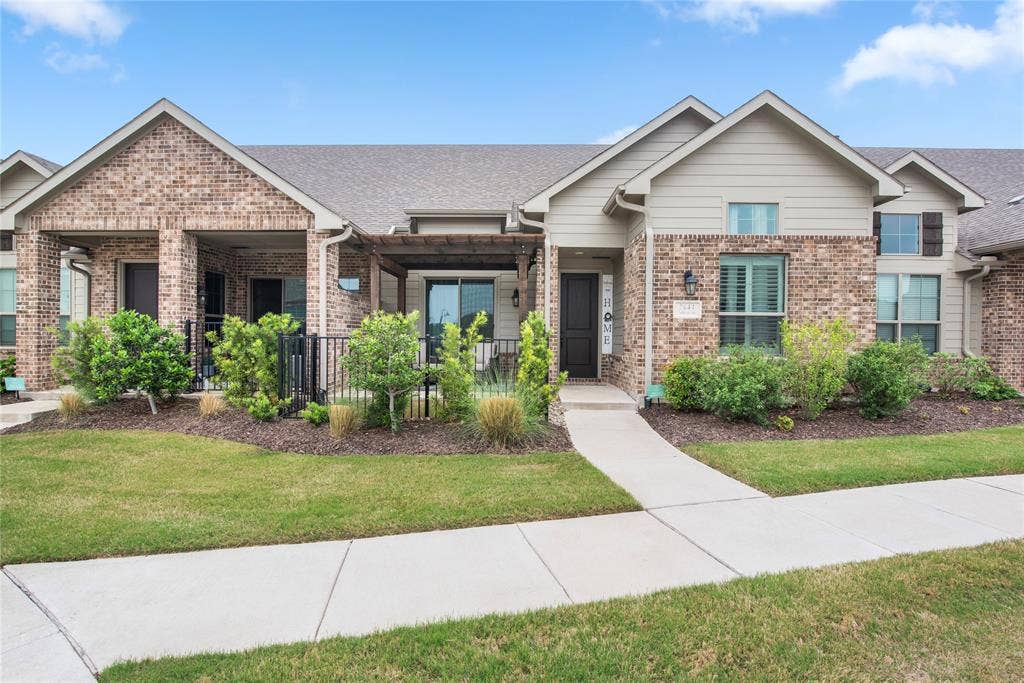 2644 Chardonnay Court, Grand Prairie, TX 75054 Brick and siding exterior with a covered porch