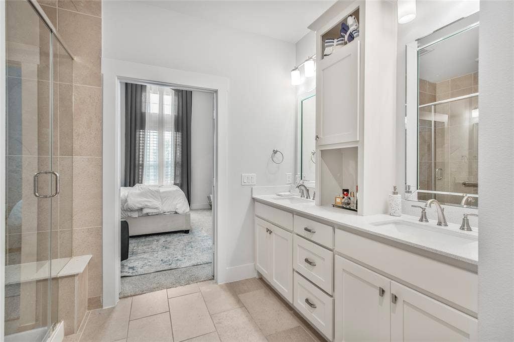 2644 Chardonnay Court, Grand Prairie, TX 75054 Dual vanity with undermount sinks, white cabinetry, and brushed nickel hardware