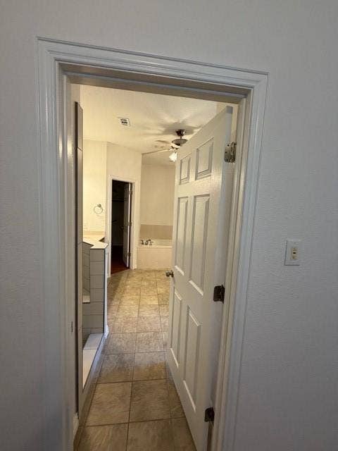 500 Leatherman Drive, Saginaw, TX 76179 Tiled flooring, white paneled door, and ceiling fan