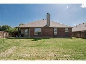 500 Leatherman Drive, Saginaw, TX 76179 Brick exterior with a covered patio and fenced backyard