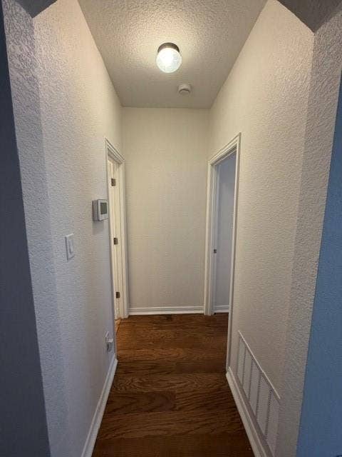 500 Leatherman Drive, Saginaw, TX 76179 Wood-finish flooring throughout the hallway, bright overhead lighting, and white trim
