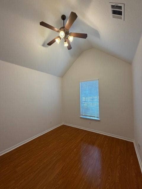 500 Leatherman Drive, Saginaw, TX 76179 Spacious room featuring soaring vaulted ceilings, warm wood-finish flooring, and abundant natural light from a large window