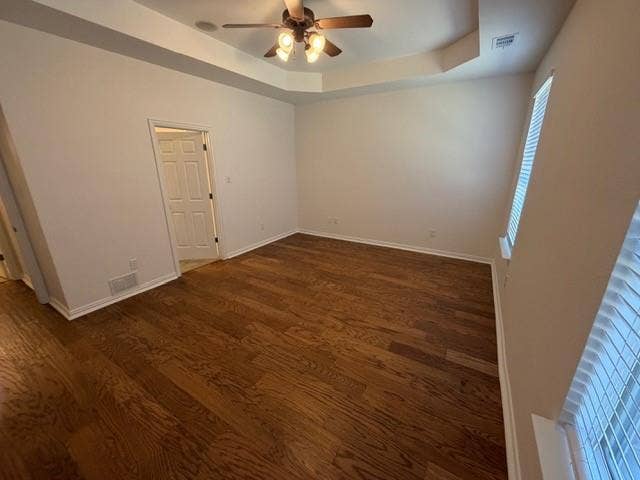 500 Leatherman Drive, Saginaw, TX 76179 Tray ceiling with a ceiling fan light fixture, wood-finish flooring, and white window blinds