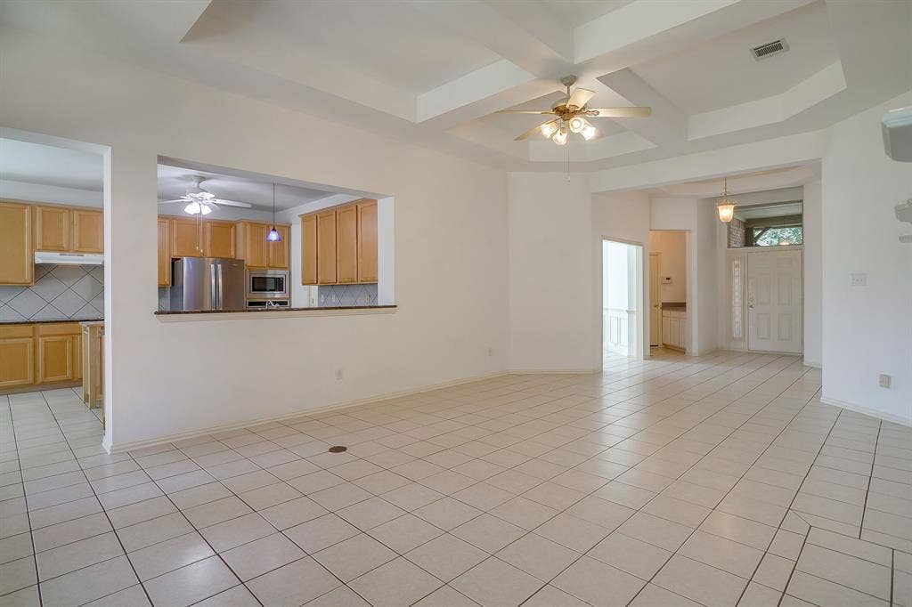View from living room into kitchen and foyer.