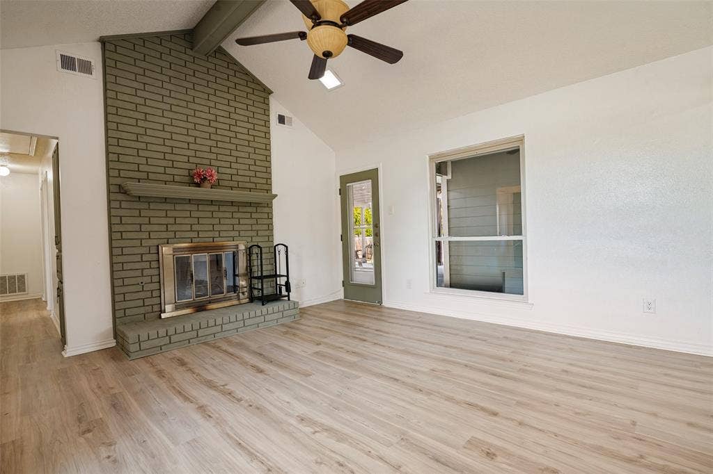 6527 Leasa Court, Sachse, TX 75048 Vaulted ceiling, brick fireplace with mantel